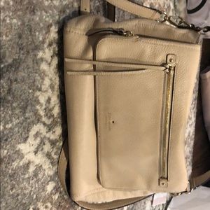 Wide, off-white, Kate Spade cross body purse.